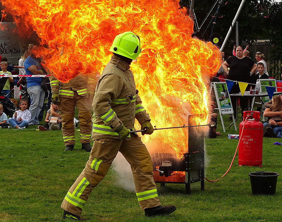 Fire brigade chip pan fire demonstration -with a cupful of water!